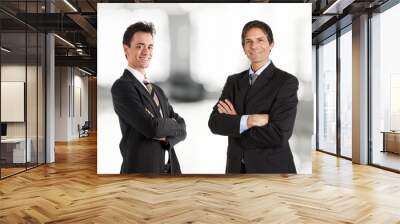 two businessmen smiling. soft background. Wall mural