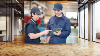 Workers using a tablet in a modern factory Wall mural