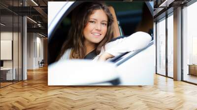 young woman in her car Wall mural