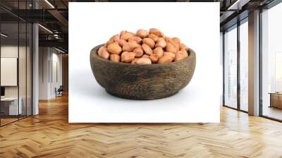 Closeup raw peanuts on wooden bowl isolated white background Wall mural