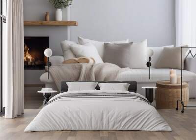 Comfortable White Sofa With Cushions And Blanket Near Fireplace Wall mural