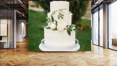 big, delicious wedding cake outdoors Wall mural