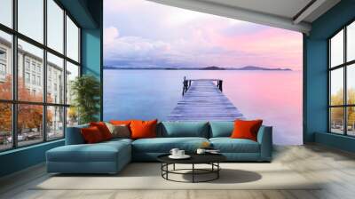 Old wooden dock at the lake, sunset shot Wall mural