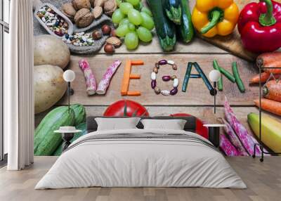 vegan word on wood background and vegetable - food Wall mural