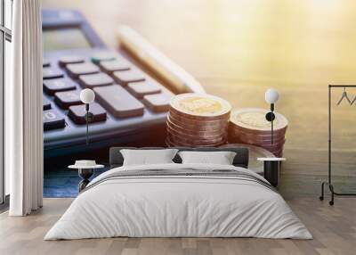 coins and calculator on table in the office for business finance accounting concept. Wall mural