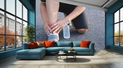 The man fill ankle or calf pain when he running exercise in a day time for sport,  ้health concept. Wall mural