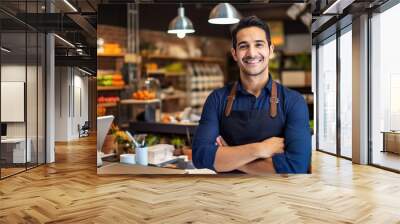 Happy shop owner in cafe or supermarket with arms crossed Wall mural