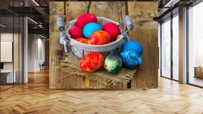 Happy Easter, colorful eggs in a basket Wall mural