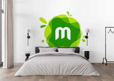 Letter M logo at green watercolor splash background. green nature logo vector Wall mural