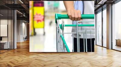 Shopping cart in the supermarket. Wall mural