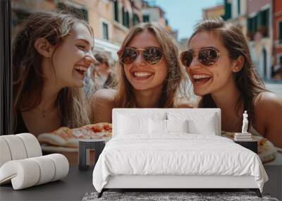 A group of girls sharing Pizza in Venice Italy on their city trip. Wall mural