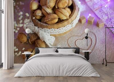 Homemade nuts cookies on old wooden table. Holiday decoration ho Wall mural