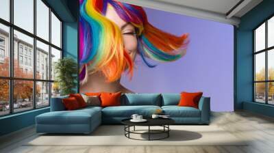 Woman hair as color splash. Rainbow up do short haircut. Beautiful young girl model with glowing  healthy skin. Smiling, positive and happy woman Wall mural