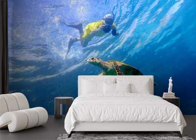 Man snorkeling with sea turtle in the tropical water of Maldives Wall mural