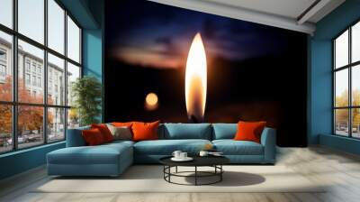 a candle burning in the dark night Wall mural