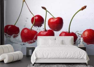 vibrant red cherries in water white background Wall mural