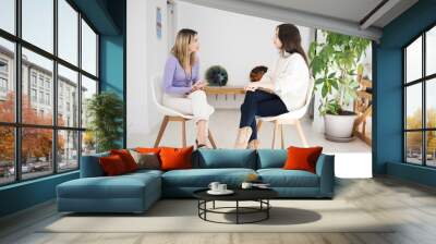 two women hold a debate and chat face to face Wall mural