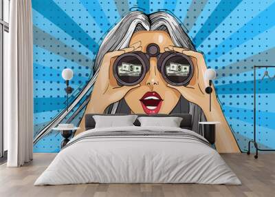 Pop art surprised woman with binoculars with a dollar sign, open mouth, surprised facial expression. Wall mural