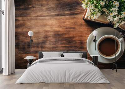 Cozy coffee moment with fresh flowers and an open book on a rustic wooden table Wall mural