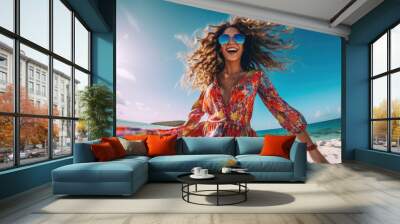 Joyful and happy woman in colorful dress on the beach.  Wall mural