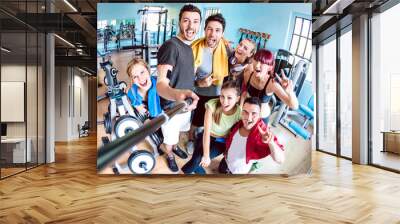 Happy young friends taking selfie after reopening of gym studio center - Sporty people ready for fitness training time together - Healthy life style and sport concept on bright azure filter Wall mural