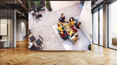 High angle top view of happy friends drinking cocktails and having fun at restaurant garden party - Food and beverage  concept with young people together at home patio - Dark warm filter Wall mural