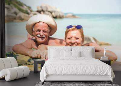 Senior couple vacationer having genuine fun on Koh Samui tropical beach in Thailand - Excursion tour in exotic scenario - Active elderly and travel concept around the world on warm bright sunny filter Wall mural