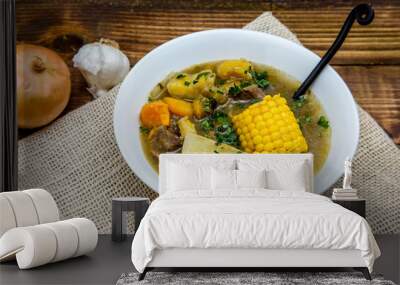 Sancocho - puerto rican beef stew on wooden table Wall mural