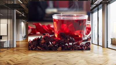 Red Hibiscus tea in glass mug Wall mural