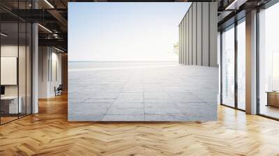 Empty concrete floor and gray wall. 3d rendering of sea view plaza with clear sky background. Wall mural