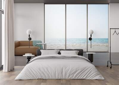 Sofa on concrete floor of large living room in modern house or luxury hotel. Minimal home interior 3d rendering with beach and sea view. Wall mural