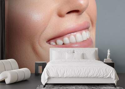 Smiling white woman with perfect skin close-up Wall mural