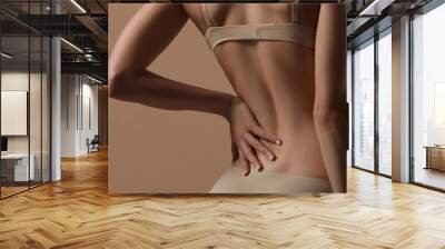 Thin young woman in underwear Wall mural