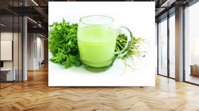 Fresh parsley juice  or coriander juice in a transparent glass isolated on white with fresh parsley leaves. Wall mural