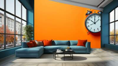 Black Alarm Clock on Orange Background Time Wall mural