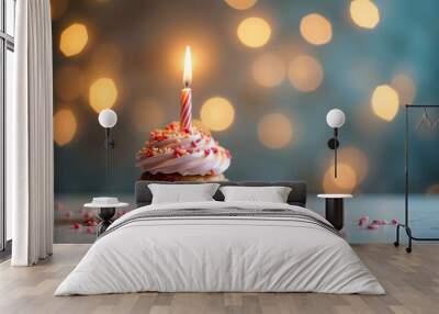 Cupcake with candle on blurred background. Concept of holiday, birthday Wall mural