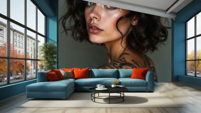 Portrait of a brunette with a tattoo on her neck. Beauty and creativity concept Wall mural