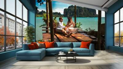 Couple on their honeymoon. Couple travels the world. Happy couple on vacation. Man and woman traveling to Thailand. Holidays on beautiful Islands. Tourists on vacation. Trip to the islands Wall mural