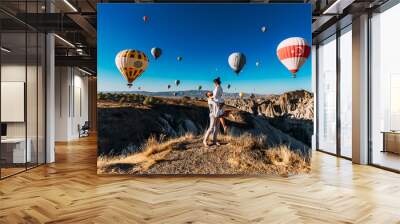 Happy couple in Cappadocia. The man proposed to the girl. Honeymoon in Cappadocia. Couple at the balloon festival. Couple travels the world. The Landscapes Of Cappadocia Wall mural