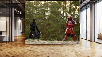 Samurai fight with ninjas on a background of forest and sand Wall mural