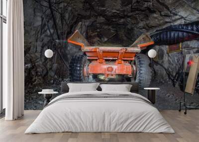 Minetruck dump haul truck in underground gold mine shaft tunnel Wall mural