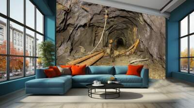 Underground abandoned gold iron ore mine shaft tunnel gallery passage with timbering wooden Wall mural