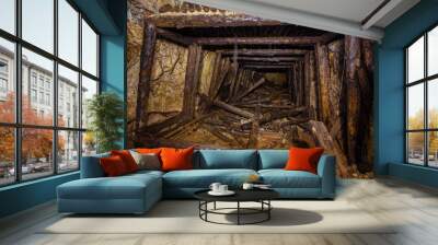 Underground abandoned gold iron ore mine shaft tunnel gallery passage wtih wooden timbering Wall mural