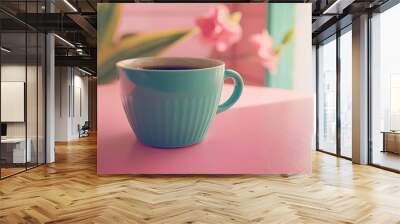 Coffee in a cyan cup on a pink table, pastel backdrop, wide-angle lens, natural lighting for web concept. Wall mural