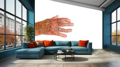 A brown hand with two silver rings of an elderly woman with Rheumatoid Arthritis disease on a white background. Wall mural