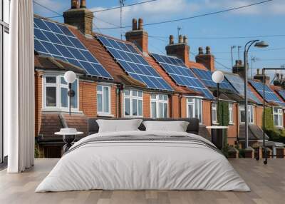 Rear of terraced houses in UK with solar panels installed. Photovoltaic system generates clean energy for homes. Renewable technology for electricity and power. Sustainable living in Britain. Wall mural