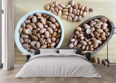 Brazilian beans. Carioca beans in a ramekin and wooden spoon. Wall mural