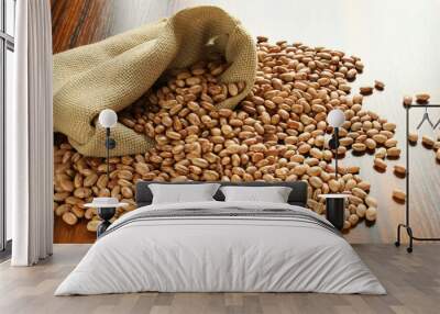 Carioca beans in a jute bag on the wooden table. Wall mural