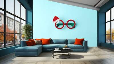 glasses santa's christmas on blue background. masquerade party new year funny sunglasses, trendy min Wall mural