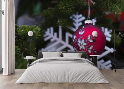 Red Merry Christmas ball hanging on fir tree, happy new year Wall mural